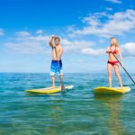 Couple Stand Up Paddle Surfing In Bohol